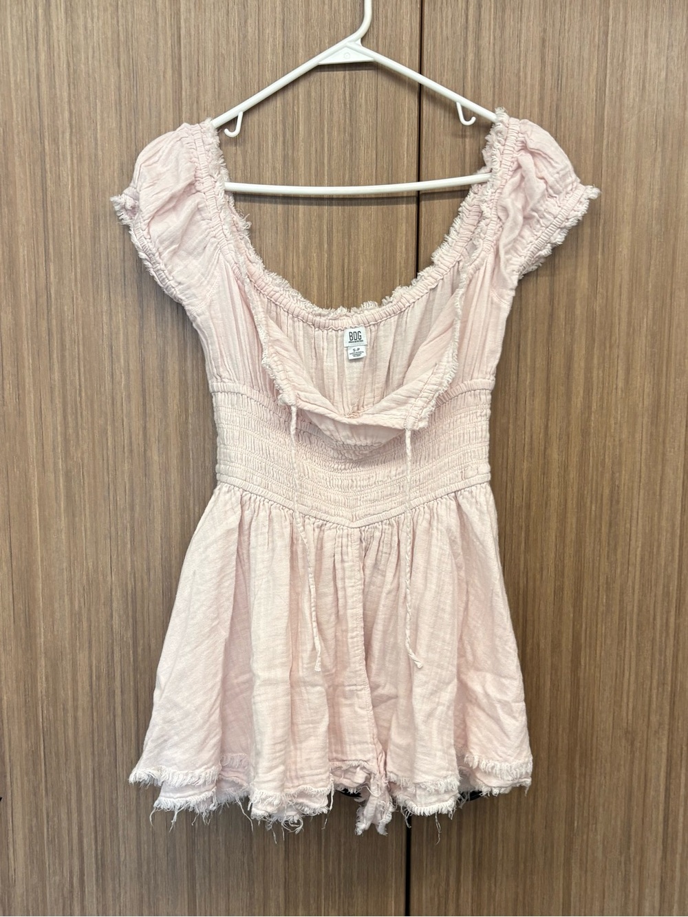 BDG Light Pink Smocked Distressed Babydoll Romper